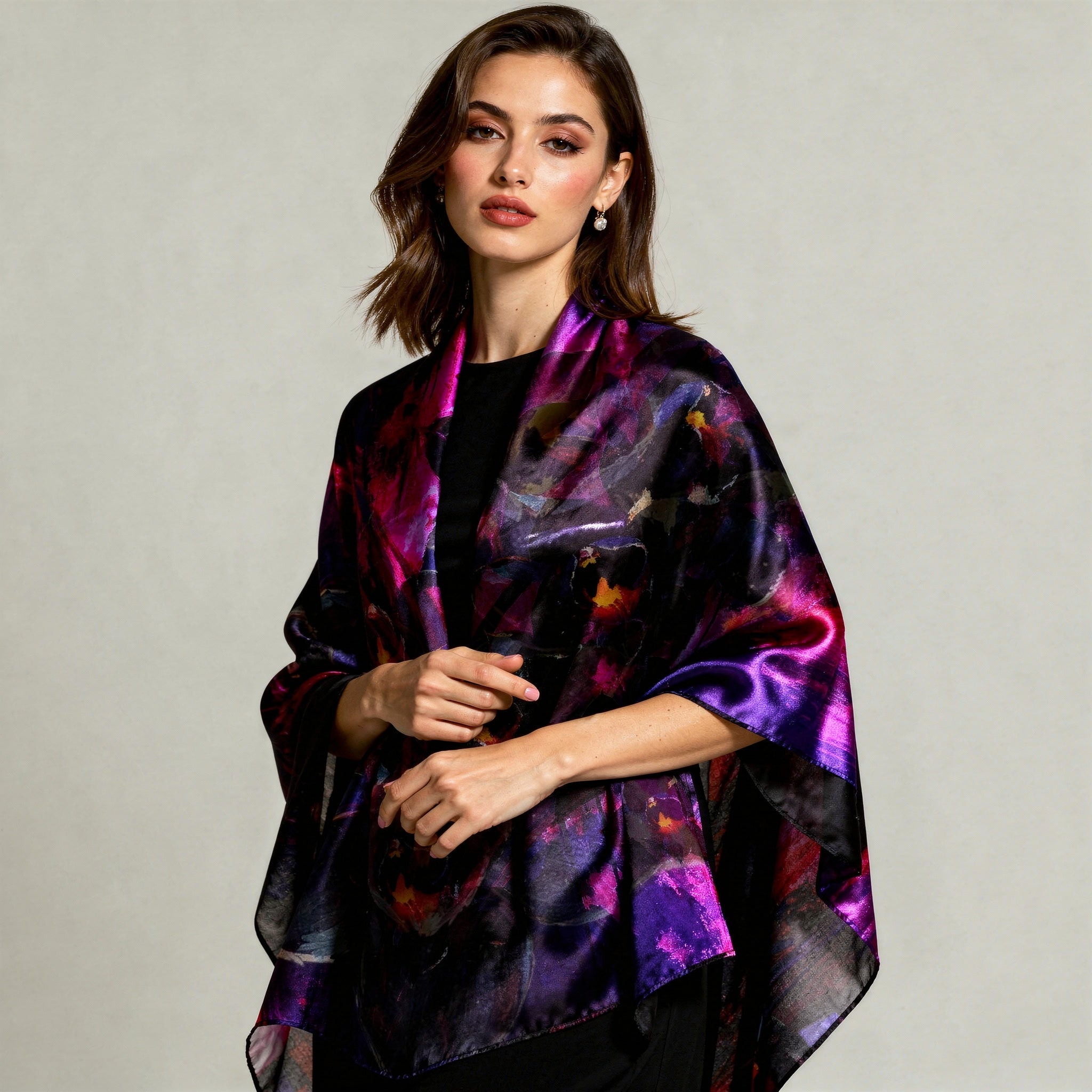 "A model in a sharp black tuxedo wearing the Petrichor Fine Art Black Fire Orchid silk shawl, showcasing the liquid-gold drape of 85gsm Mulberry Silk in a gallery setting."